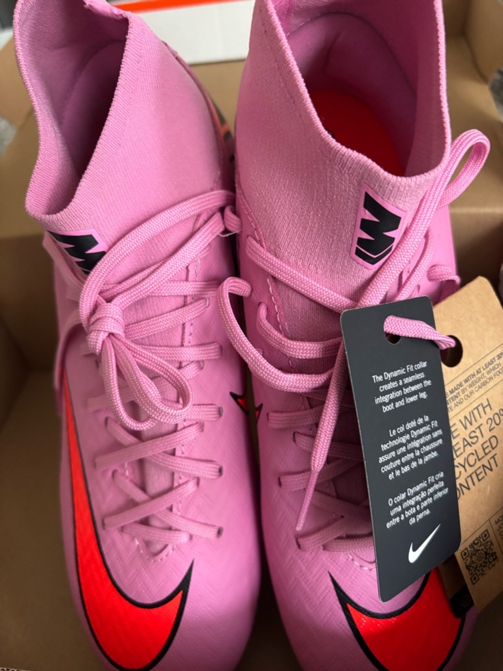 Nike Pink Soccer Cleats with Red Swoosh